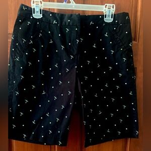 IZOD Black golf shorts with Green and White tees and golf ball Pattern size 8